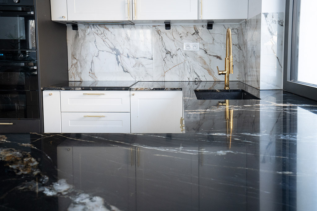 white and black modern kitchen room with marble countertops