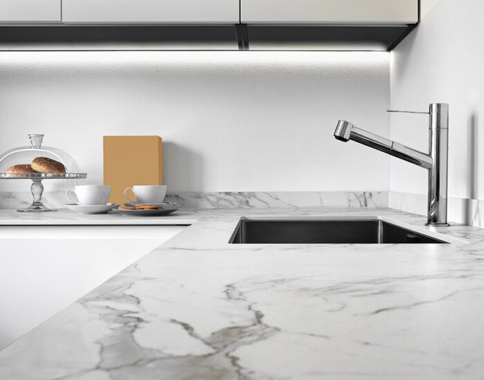 close up of a worktop of a modern kitchen in the foreground the